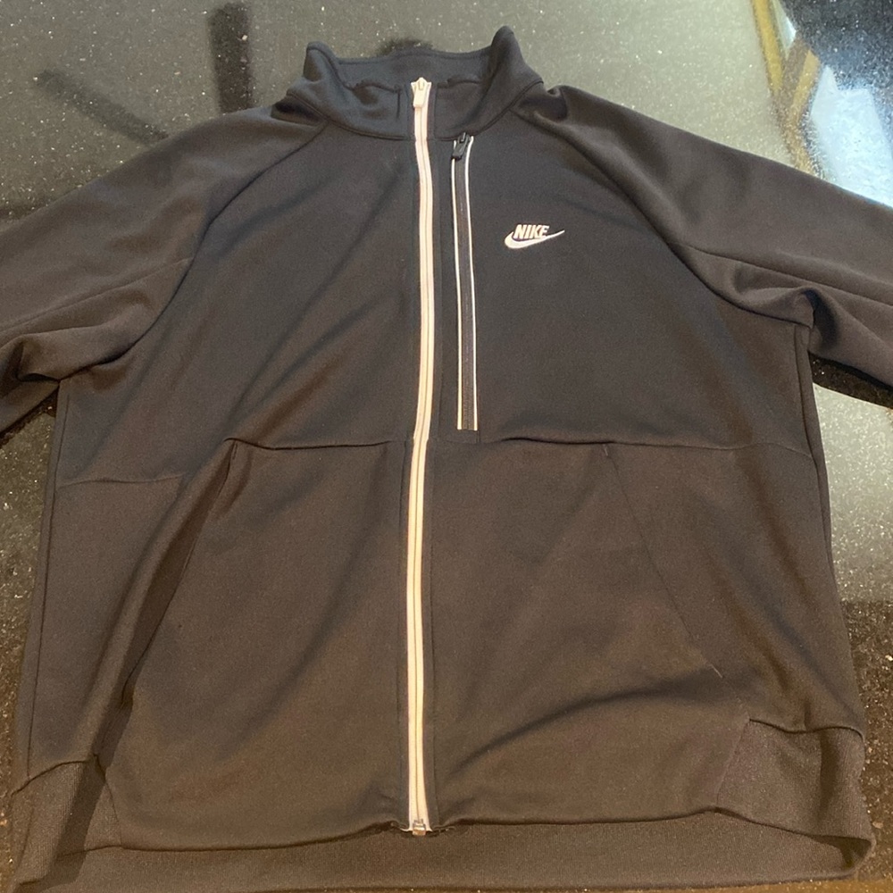 Black and white Nike zip up Jacket
